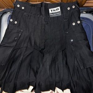 TKN Nation Utility Kilt - a traditional Scottish garment in classic black color